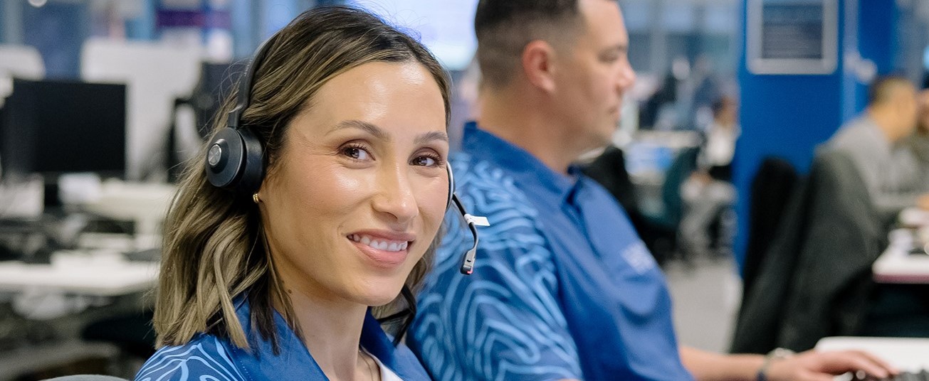 Person with a headset smiling