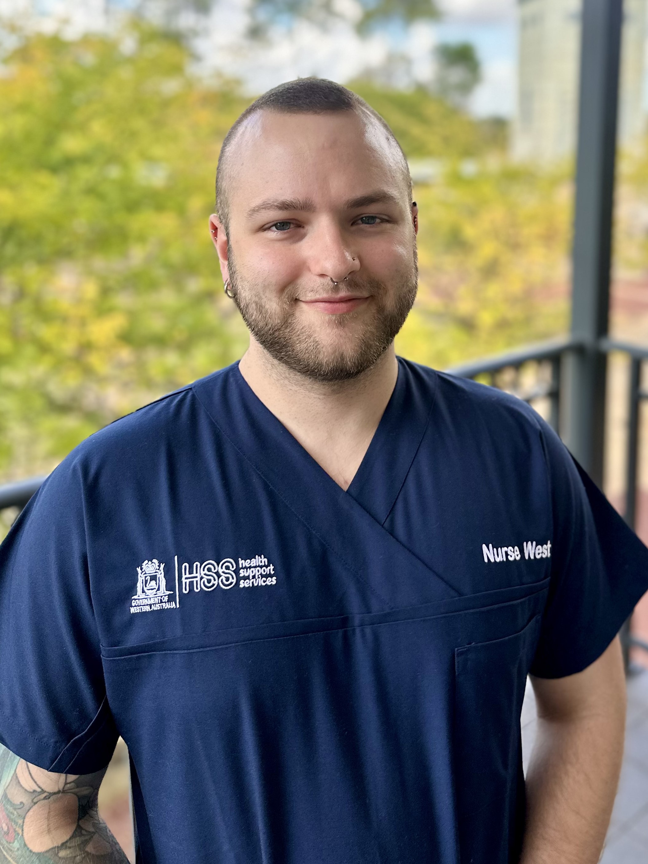 Person standing with a NurseWest shirt on