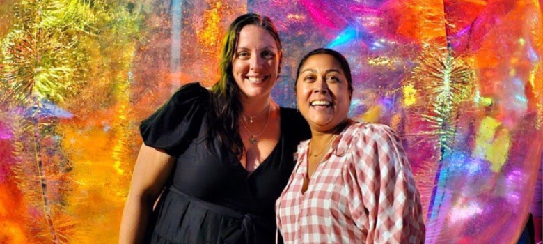 Two people smiling