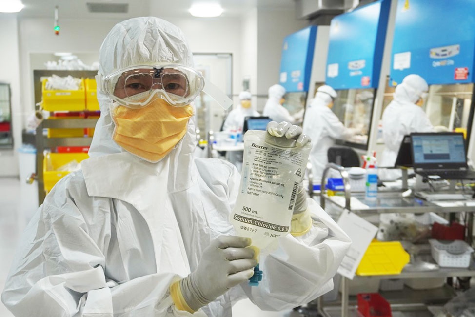 scientist holding pharmaceutical bag